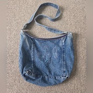 Jean purse with cute floral embroidered detail with adjustable strap